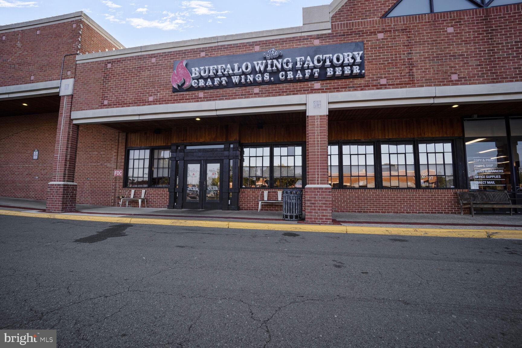 13802 Poplar Tree Road Chantilly, VA 20151 - Photo 61 of 61 a view of a building with large windows and outdoor seating