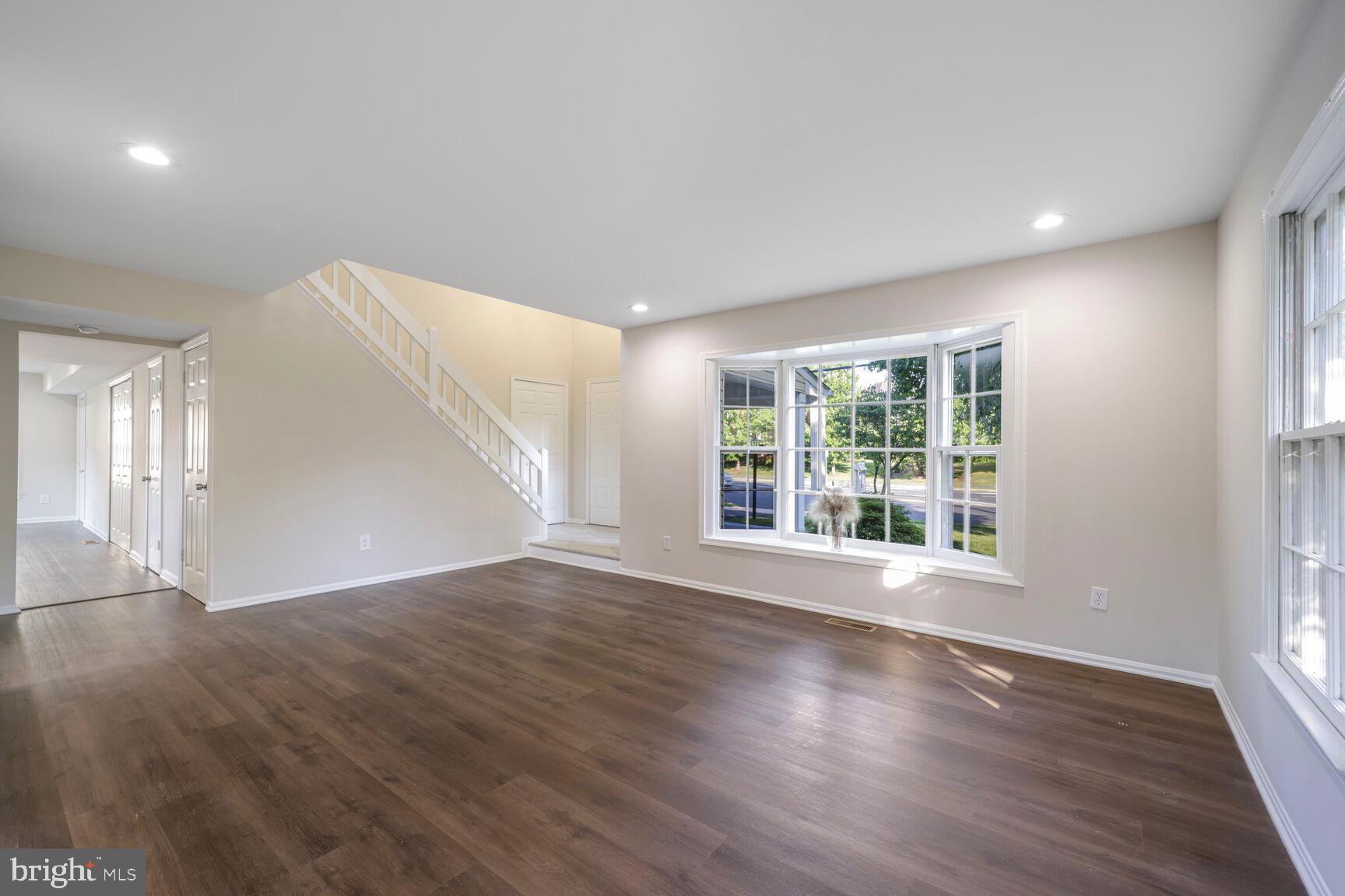13802 Poplar Tree Road Chantilly, VA 20151 - Photo 7 of 61 a view of an empty room with wooden floor and a window