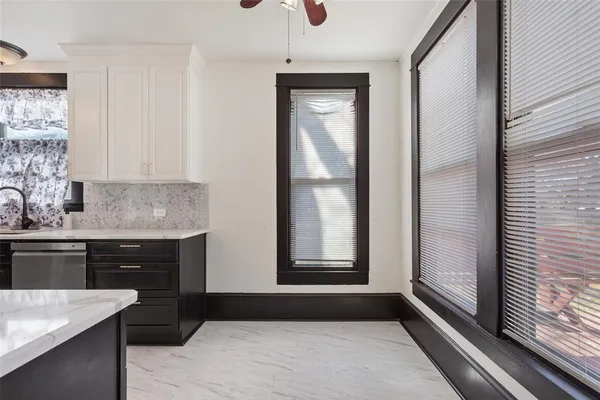 a kitchen with a refrigerator and a sink