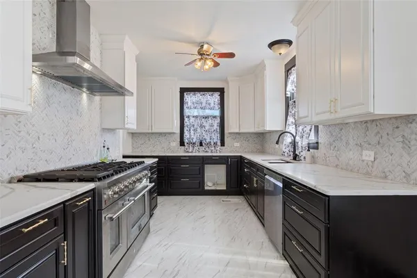 a kitchen with a sink stove and cabinets