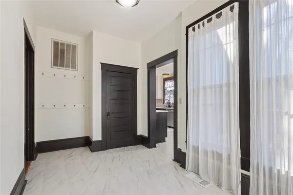 a bedroom with a bed and a mirror