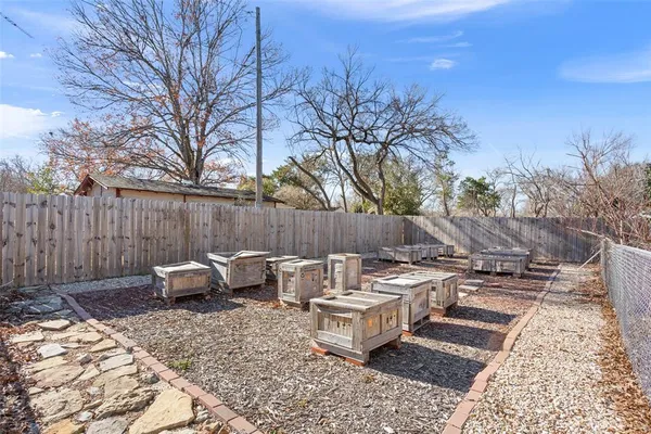 a backyard of a house with outdoor seating