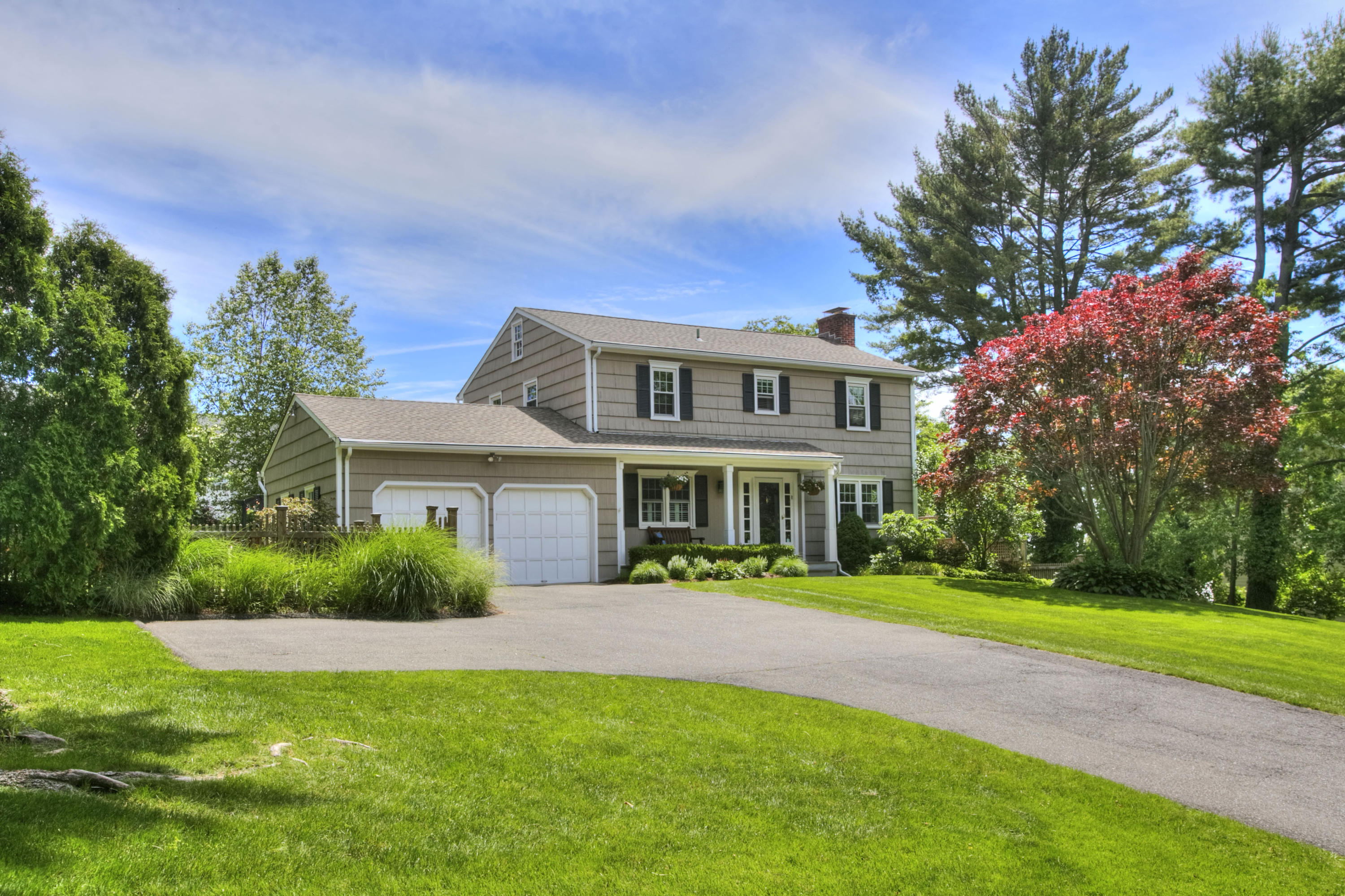 20 Hollow Tree Ridge Road Darien, CT 06820 - Photo 1 of 25 a front view of a house with a yard