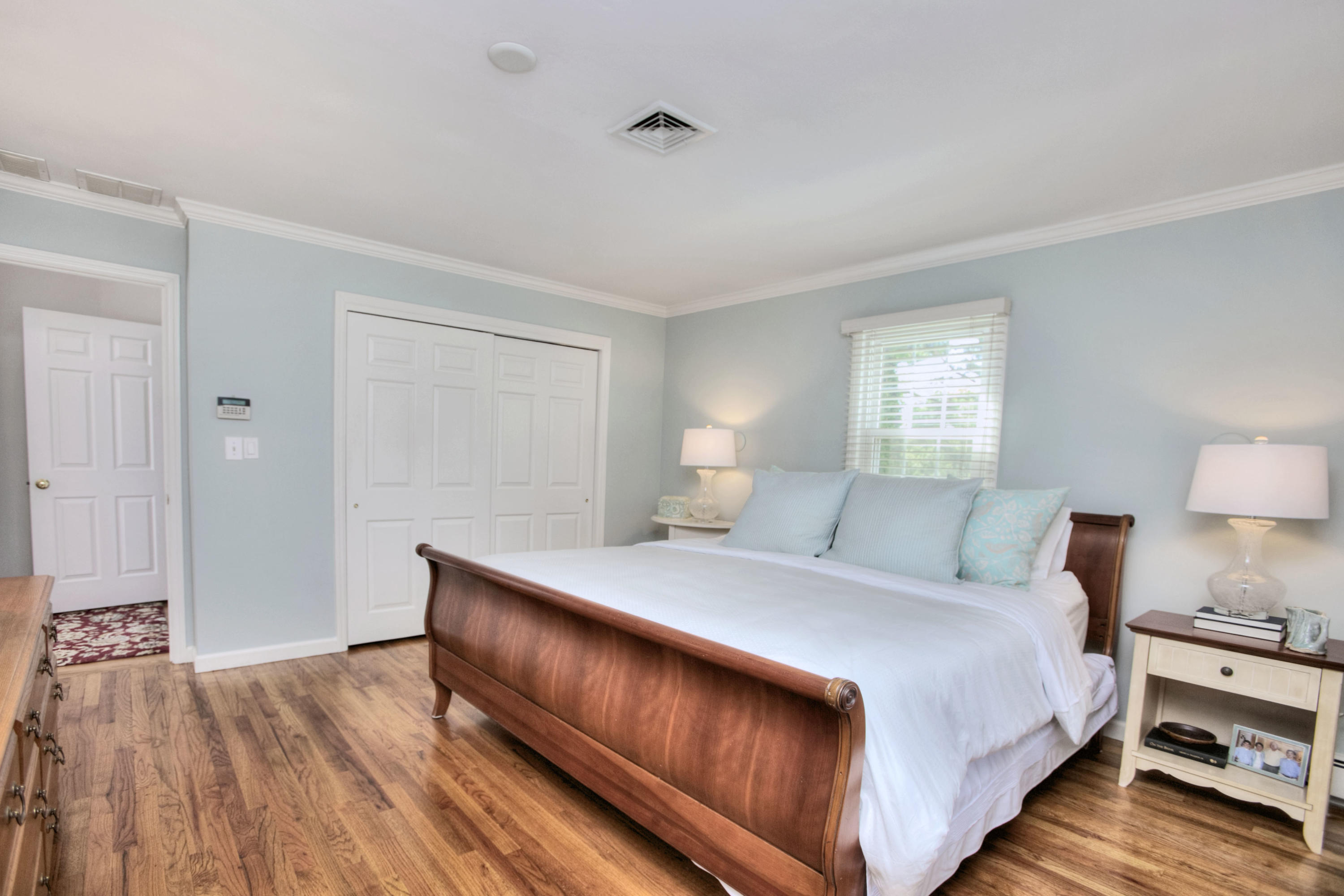 20 Hollow Tree Ridge Road Darien, CT 06820 - Photo 16 of 25 a bedroom with a bed and wooden floor
