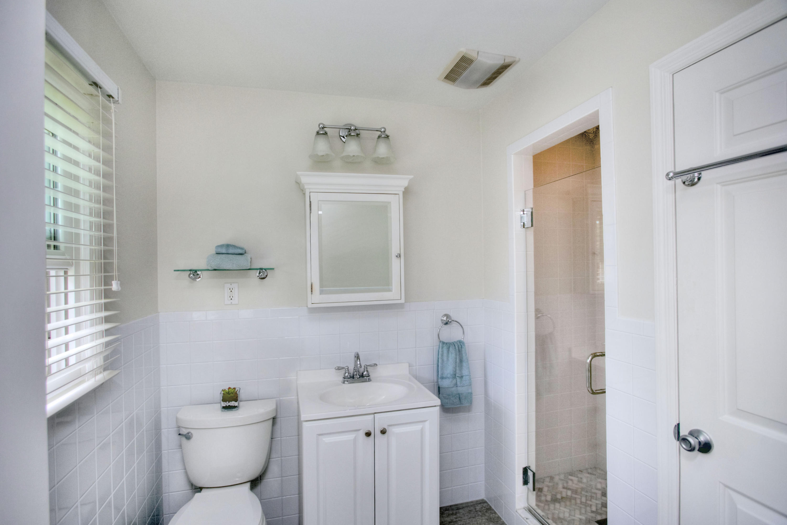 20 Hollow Tree Ridge Road Darien, CT 06820 - Photo 17 of 25 a bathroom with a toilet sink and mirror