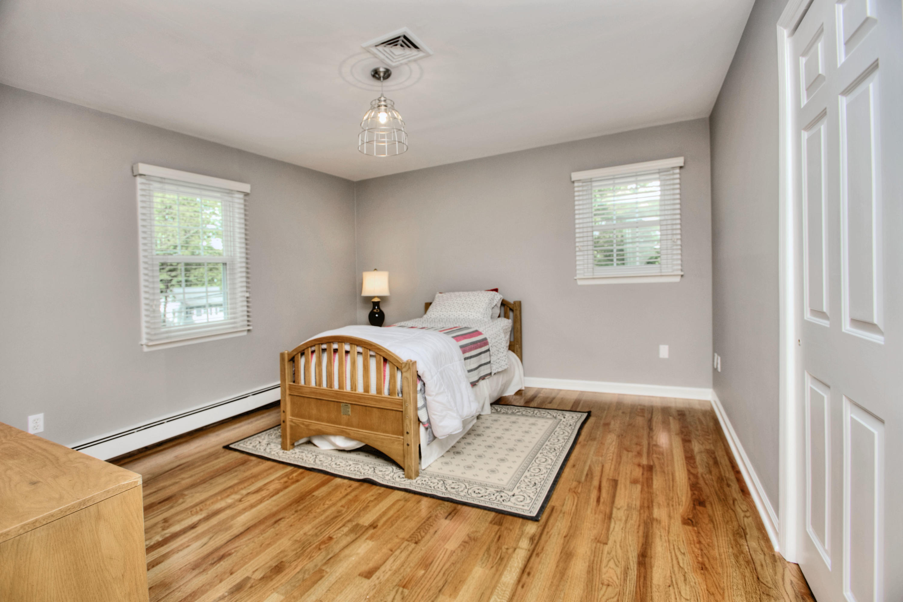 20 Hollow Tree Ridge Road Darien, CT 06820 - Photo 18 of 25 a spacious bedroom with a bed and a window
