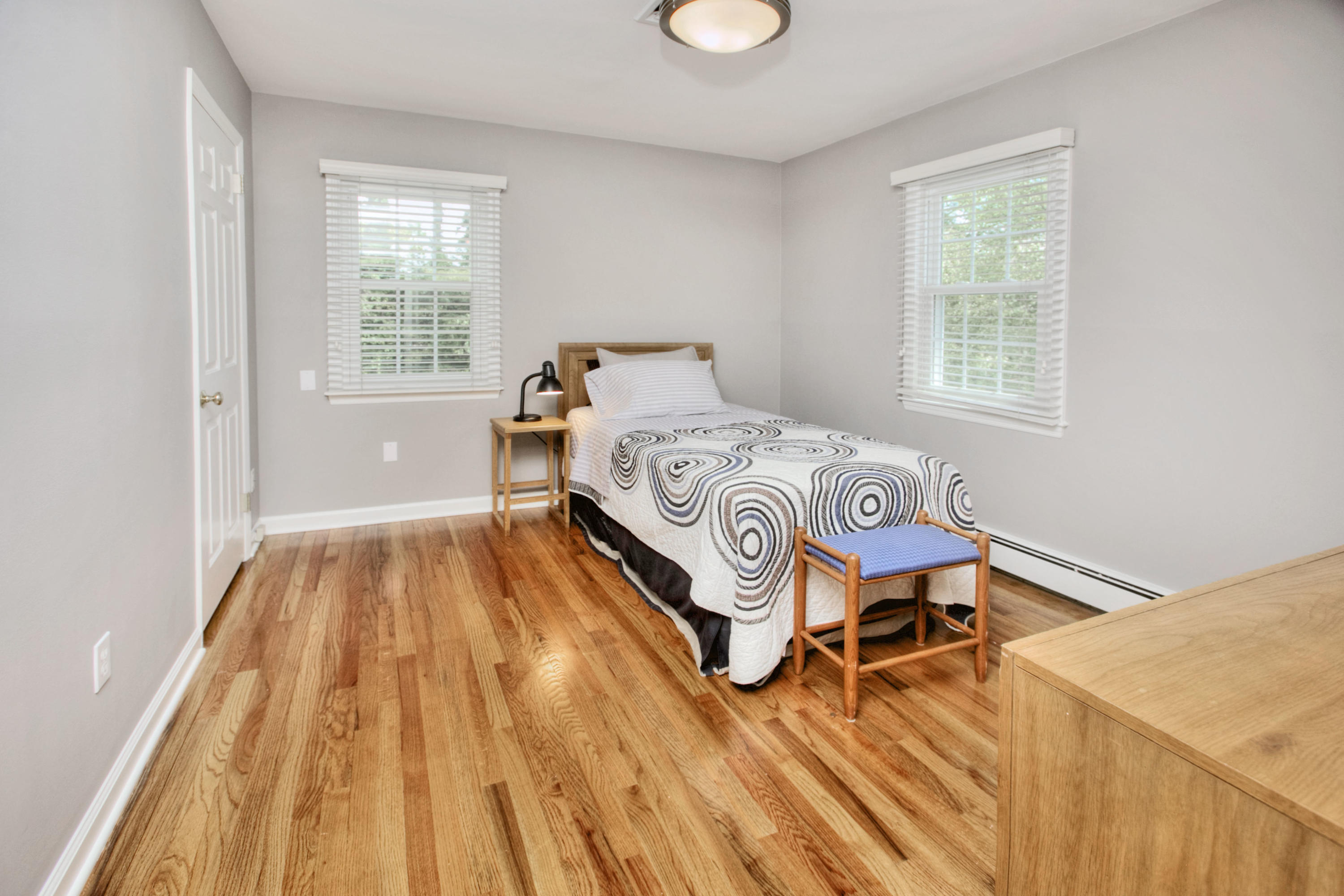 20 Hollow Tree Ridge Road Darien, CT 06820 - Photo 19 of 25 a room with a bed and wooden floor