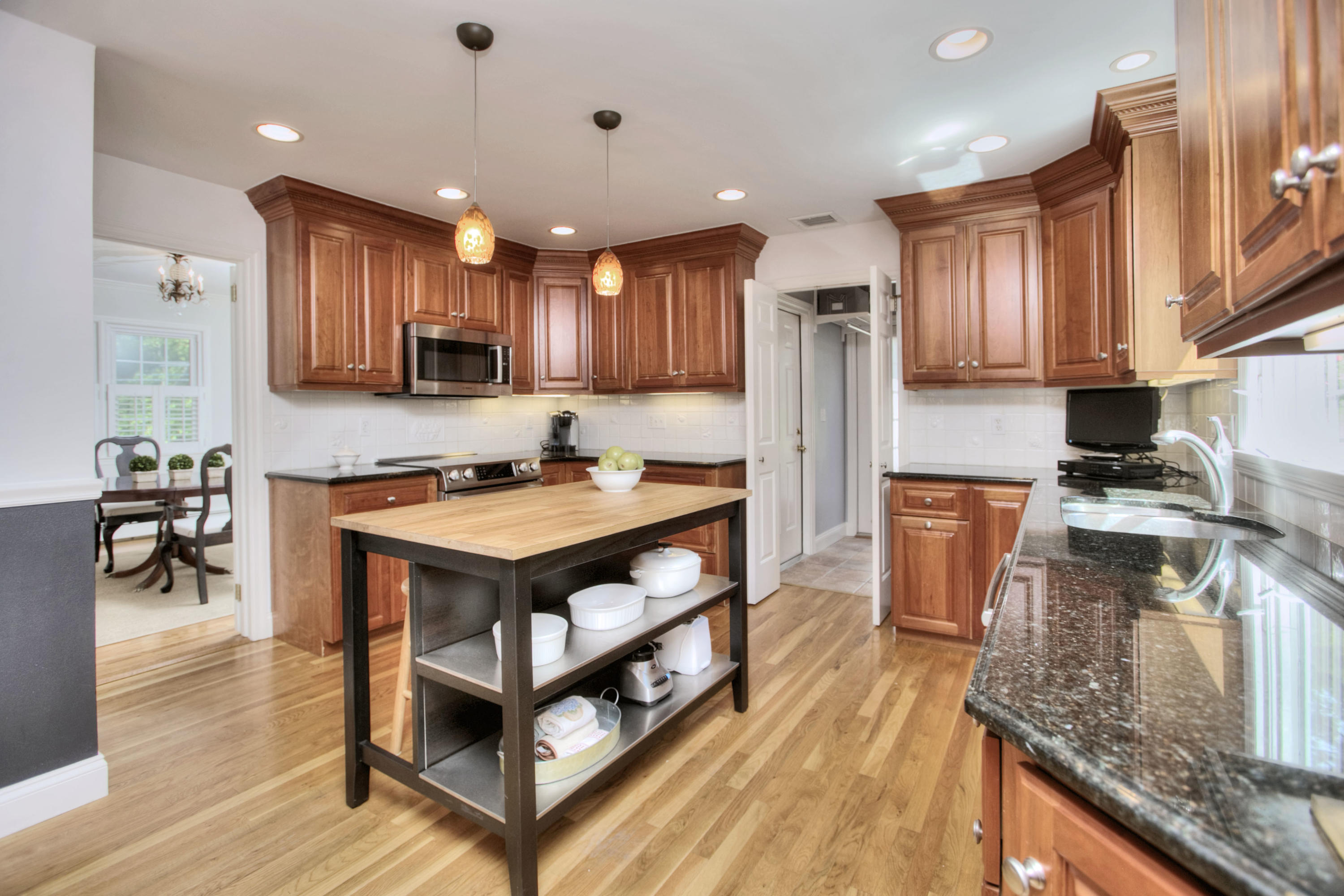 20 Hollow Tree Ridge Road Darien, CT 06820 - Photo 9 of 25 a kitchen with stainless steel appliances granite countertop a stove refrigerator and a sink