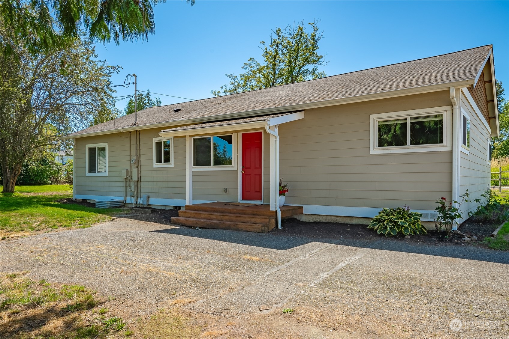 680 East Smith Road Bellingham, WA 98226 - Photo 1 of 32 a backyard of a house with barbeque oven and outdoor seating