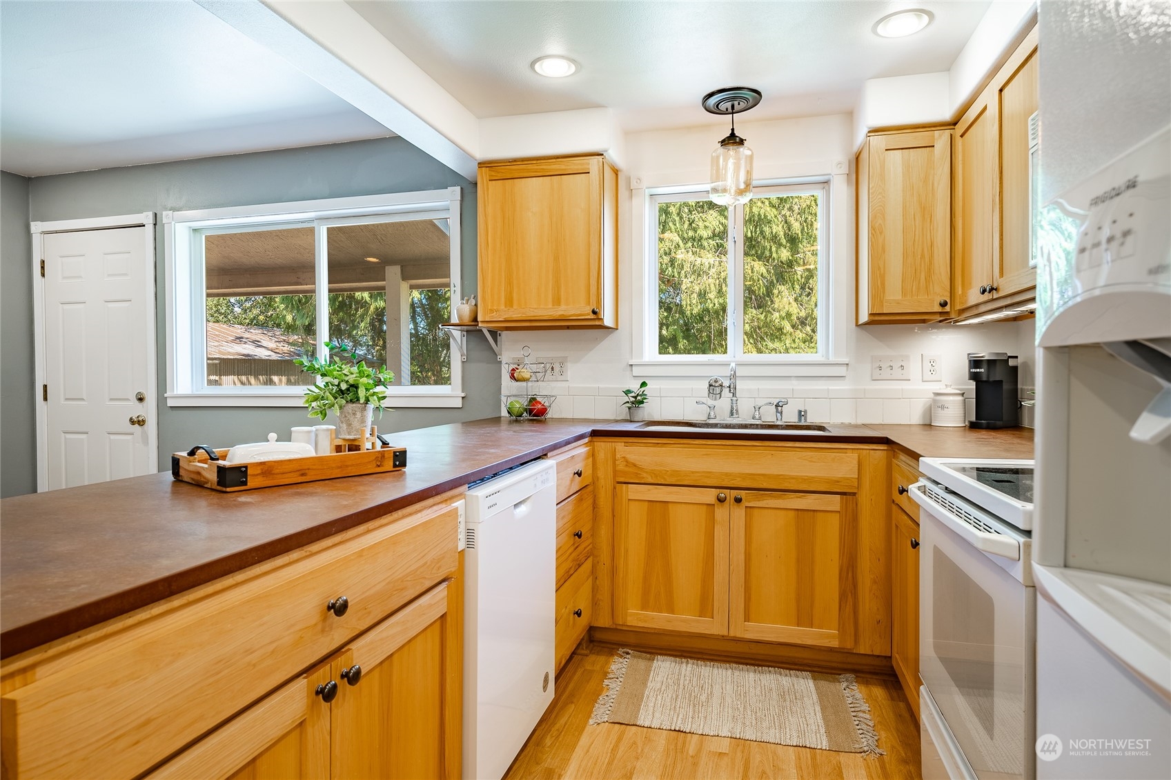 680 East Smith Road Bellingham, WA 98226 - Photo 8 of 32 a kitchen with stainless steel appliances a sink a stove and a window
