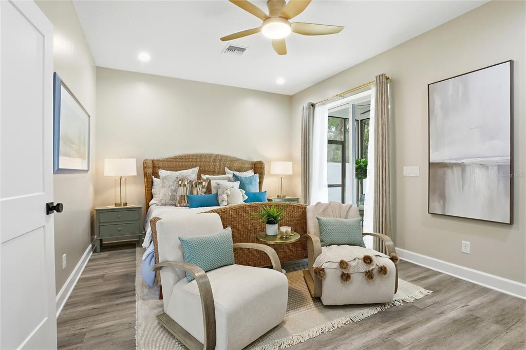 1012 Farmstead Street Eustis, FL 32736 - Photo 12 of 28 a bedroom with furniture and wooden floor