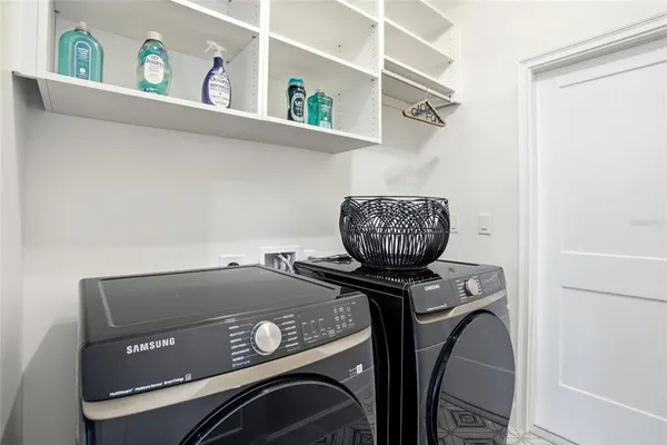 a utility room with dryer and washer