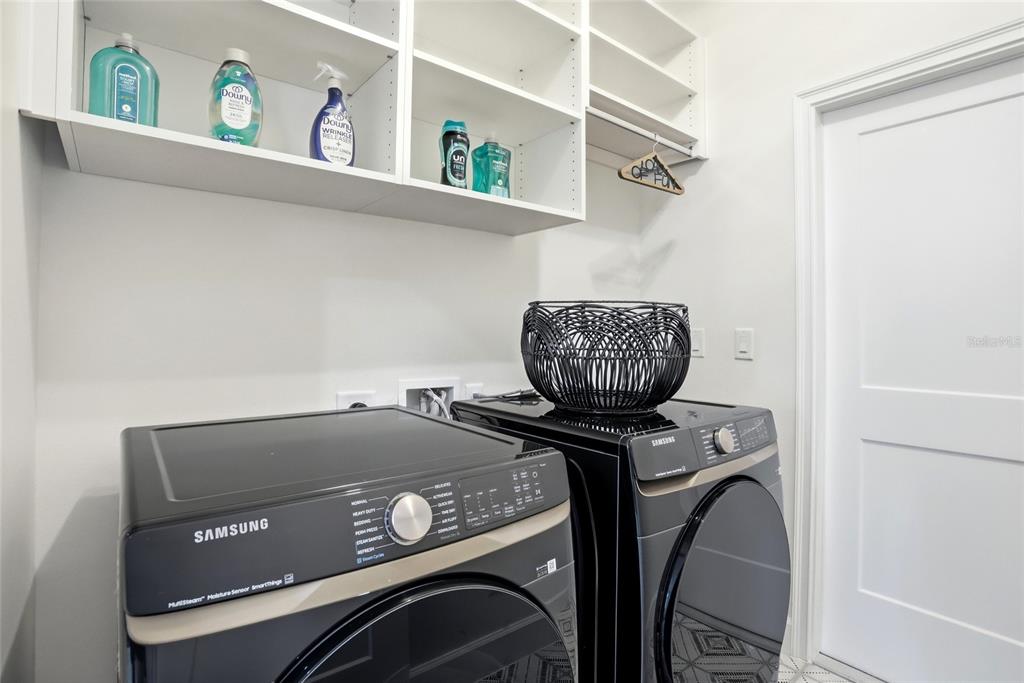 1012 Farmstead Street Eustis, FL 32736 - Photo 18 of 28 a utility room with dryer and washer