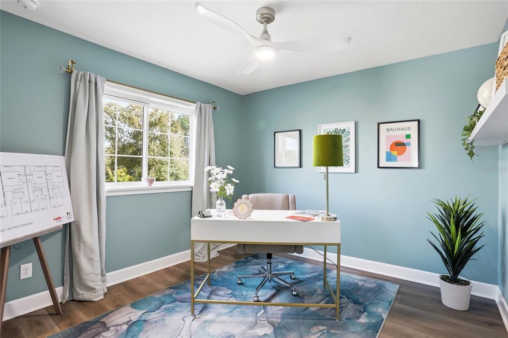 1012 Farmstead Street Eustis, FL 32736 - Photo 22 of 28 a workspace with furniture and window