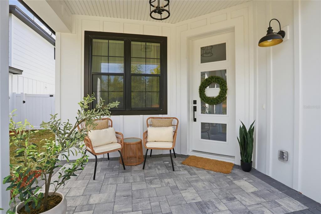 1012 Farmstead Street Eustis, FL 32736 - Photo 27 of 28 a balcony with couple of chairs and a potted plant