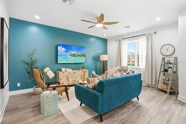 a living room with furniture and a large window