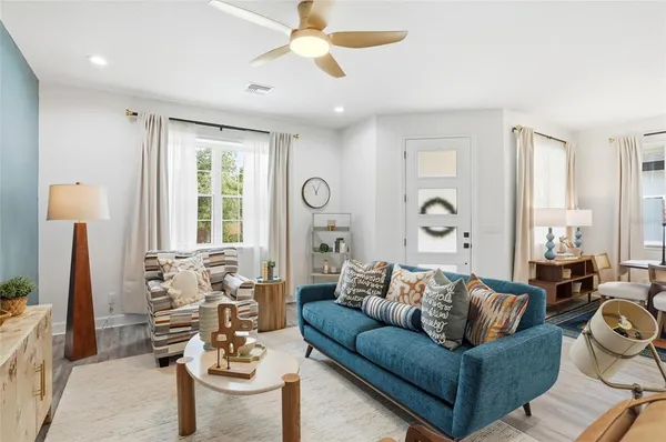 a living room with furniture and a large window