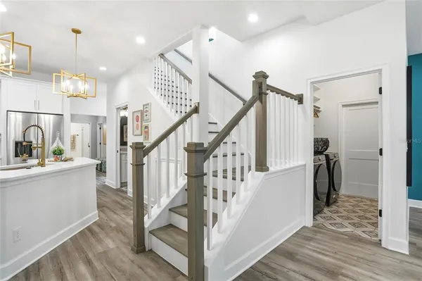 a view of entryway and hall with wooden floor