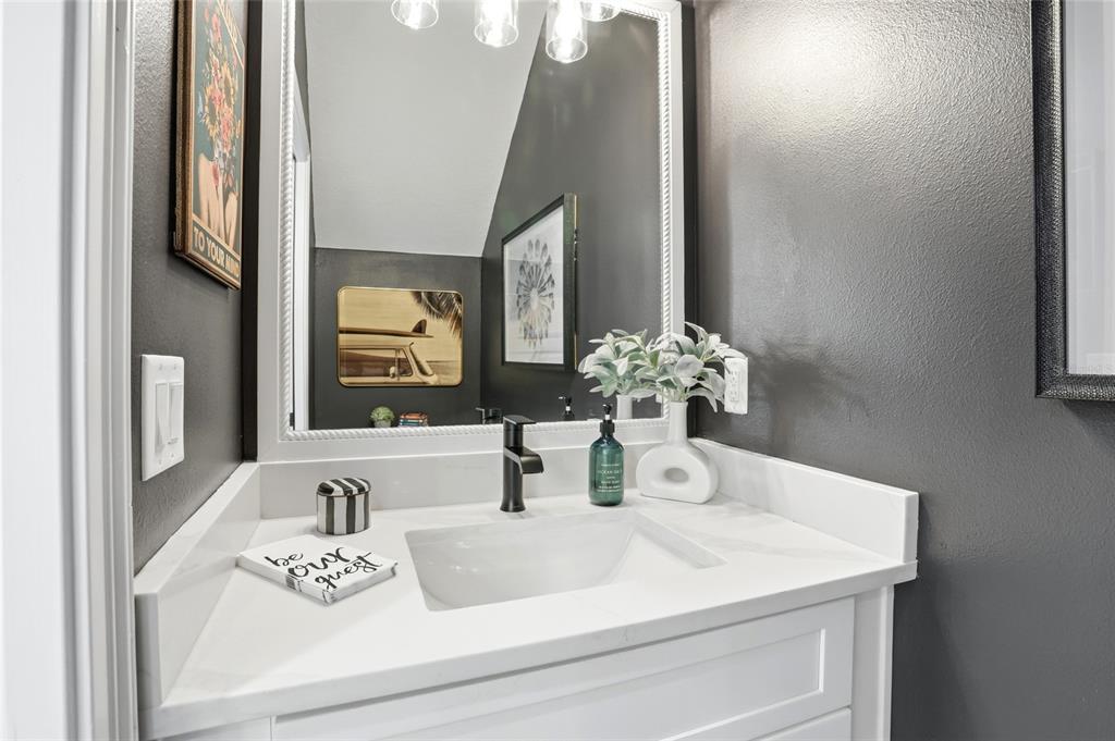 1012 Farmstead Street Eustis, FL 32736 - Photo 10 of 28 a bathroom with a sink and a mirror