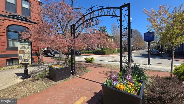 a view of a street with sitting area