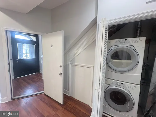 a view of a hallway with washer and dryer