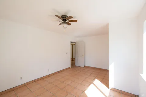 a view of a room with a empty space and wooden floor