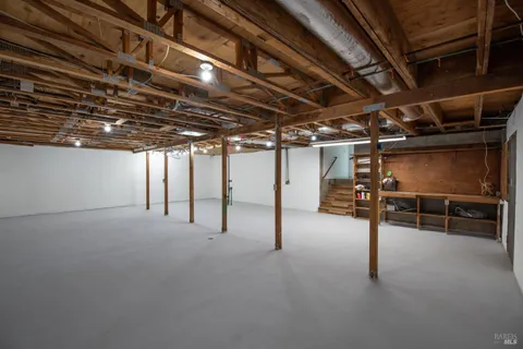 a view of empty room with wooden ceiling