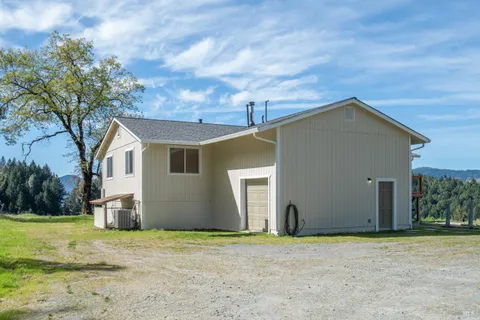 a house with trees in the background