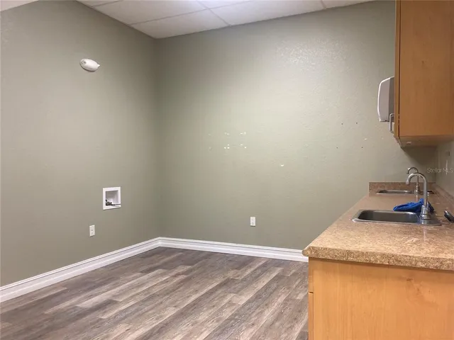 a kitchen with a sink and cabinets