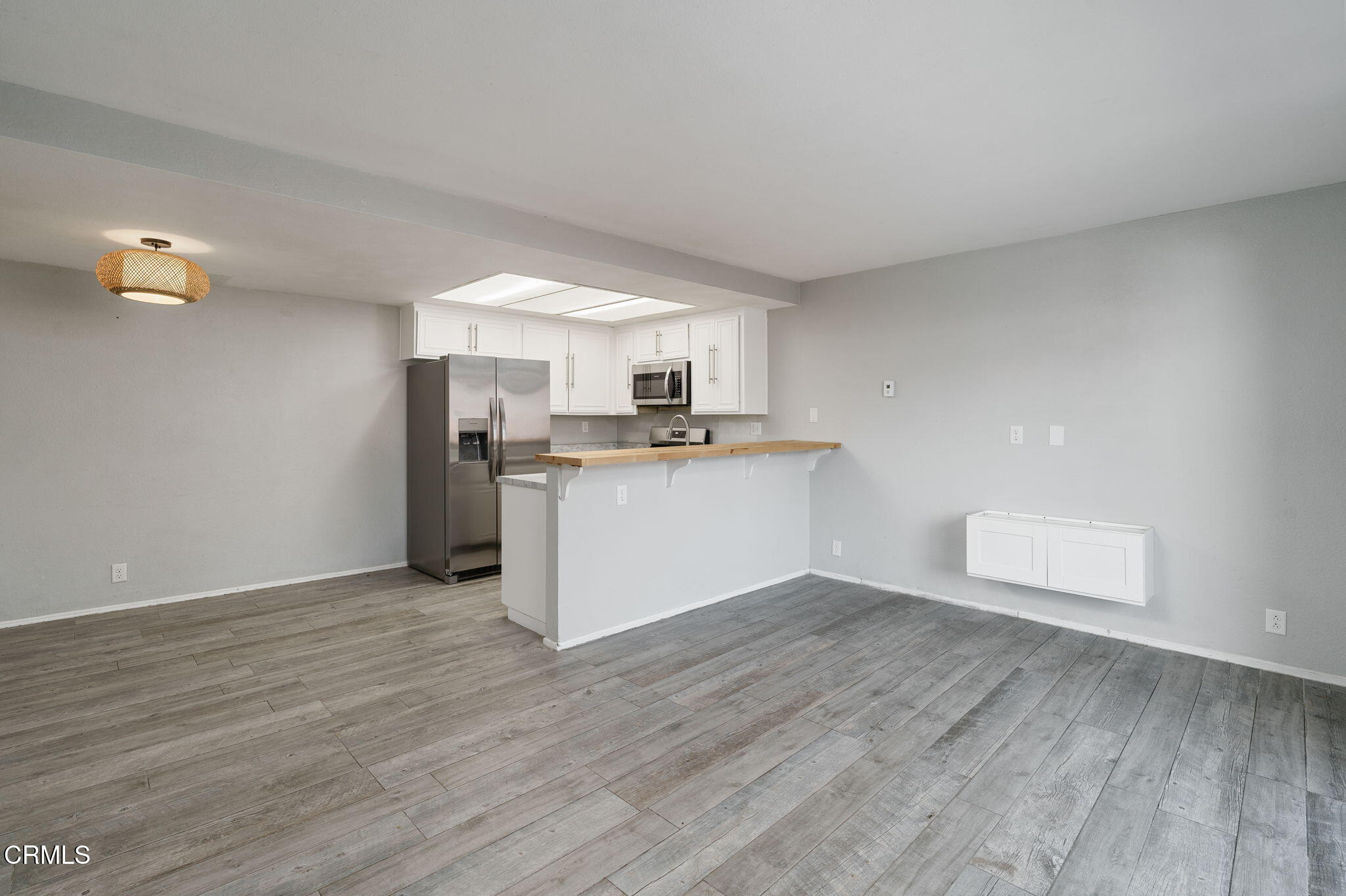 4526 Saviers Road Oxnard, CA 93033 - Photo 4 of 20 a view of a kitchen with a sink stove cabinets and empty room