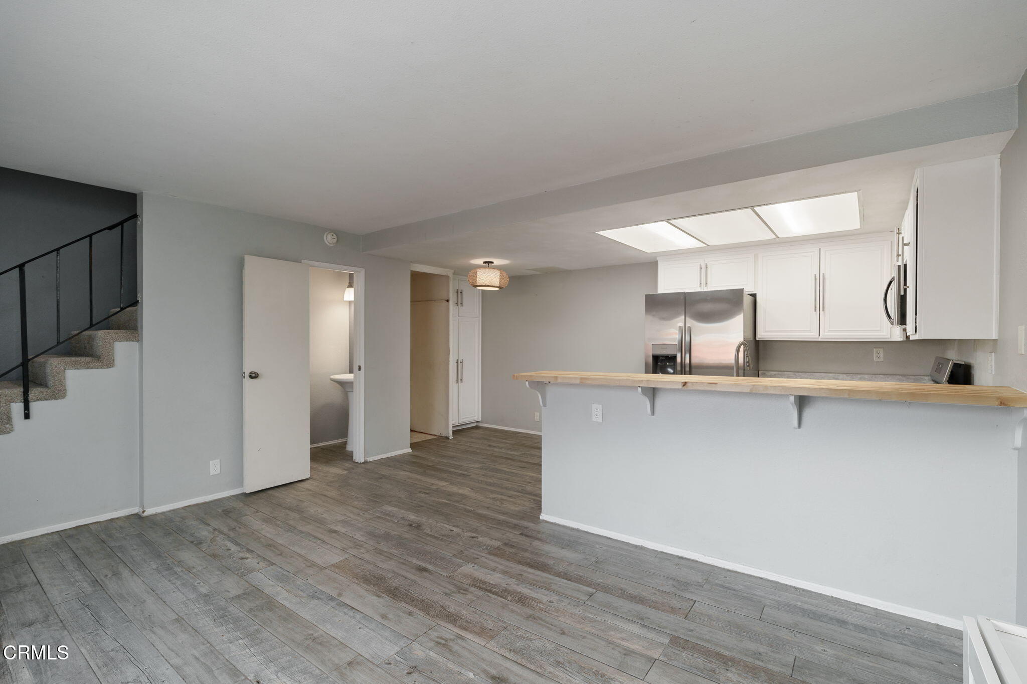 4526 Saviers Road Oxnard, CA 93033 - Photo 5 of 20 a view of kitchen with stainless steel appliances cabinets and wooden floor