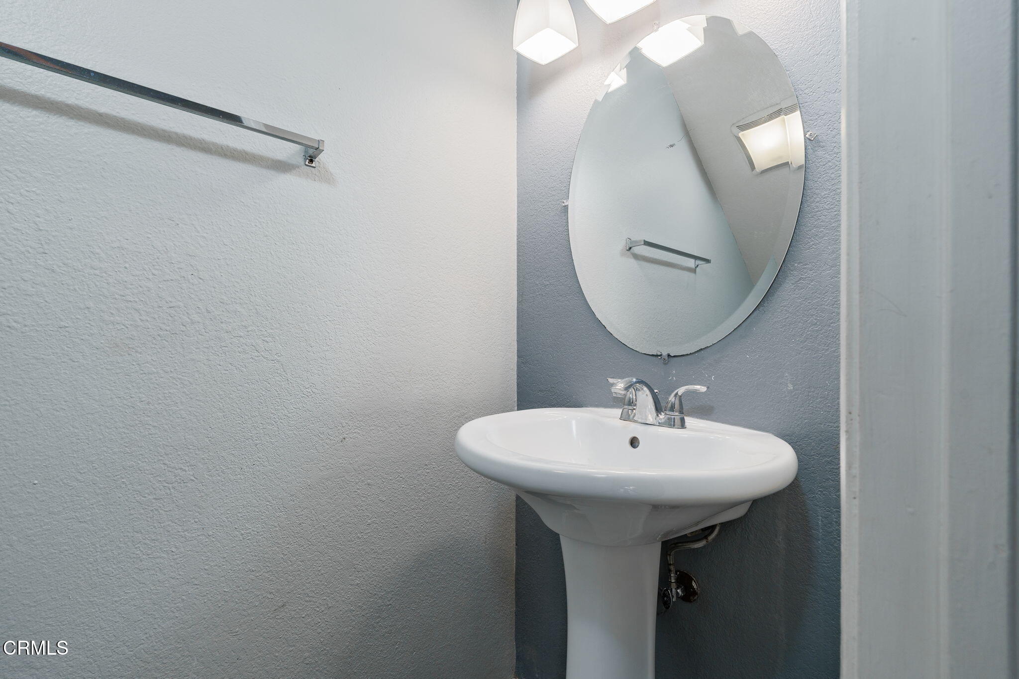 4526 Saviers Road Oxnard, CA 93033 - Photo 10 of 20 a bathroom with a sink and a mirror