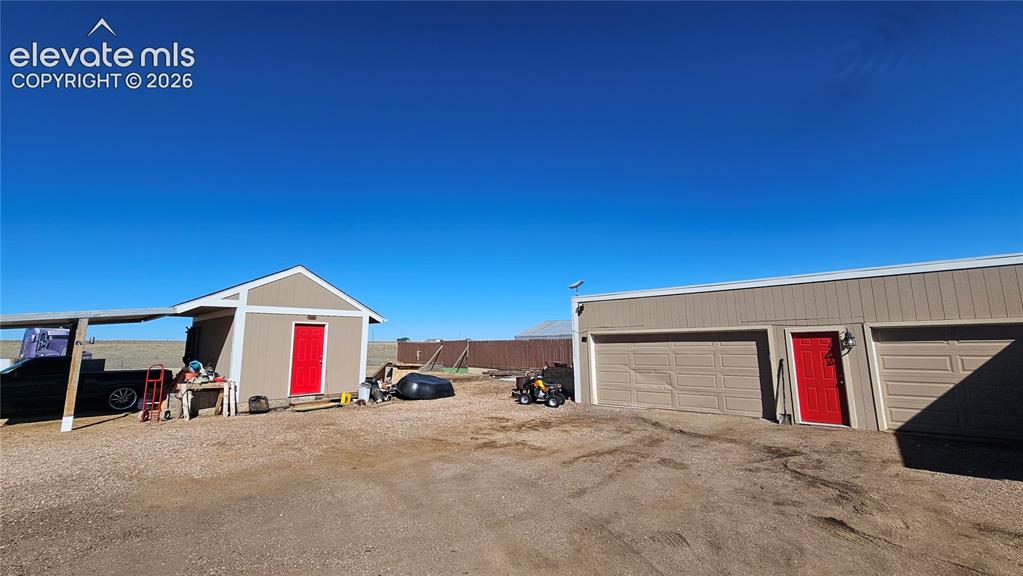 3835 Sengbeil Road Yoder, CO 80864 - Photo 44 of 48 a view of multiple houses with a road