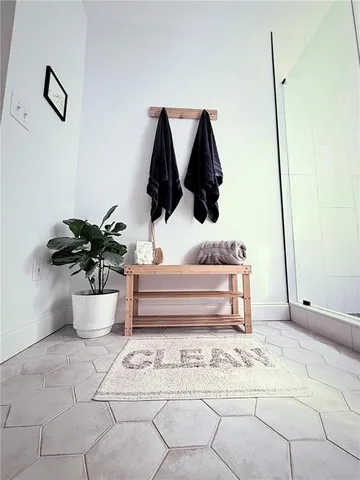 a bathroom with a bathtub and shower