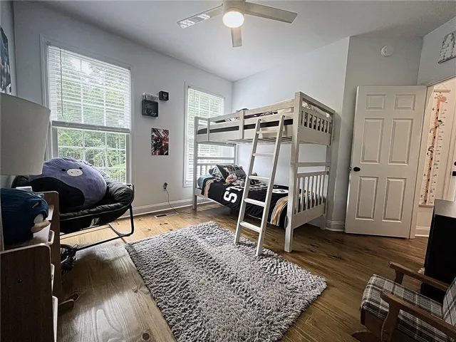 a bedroom with furniture and a window