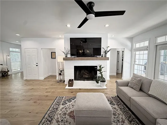 a living room with furniture and a fireplace