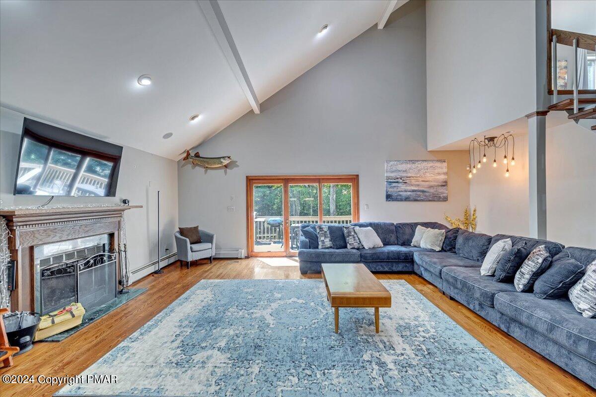 401 Minsi Trail West Long Pond, PA 18334 - Photo 14 of 34 a living room with a couch and a fireplace