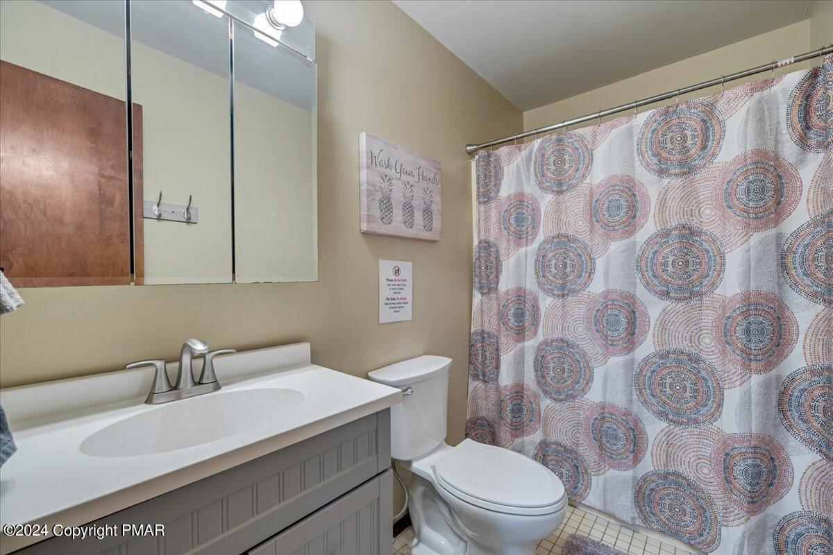 401 Minsi Trail West Long Pond, PA 18334 - Photo 28 of 34 a bathroom with a sink and a mirror