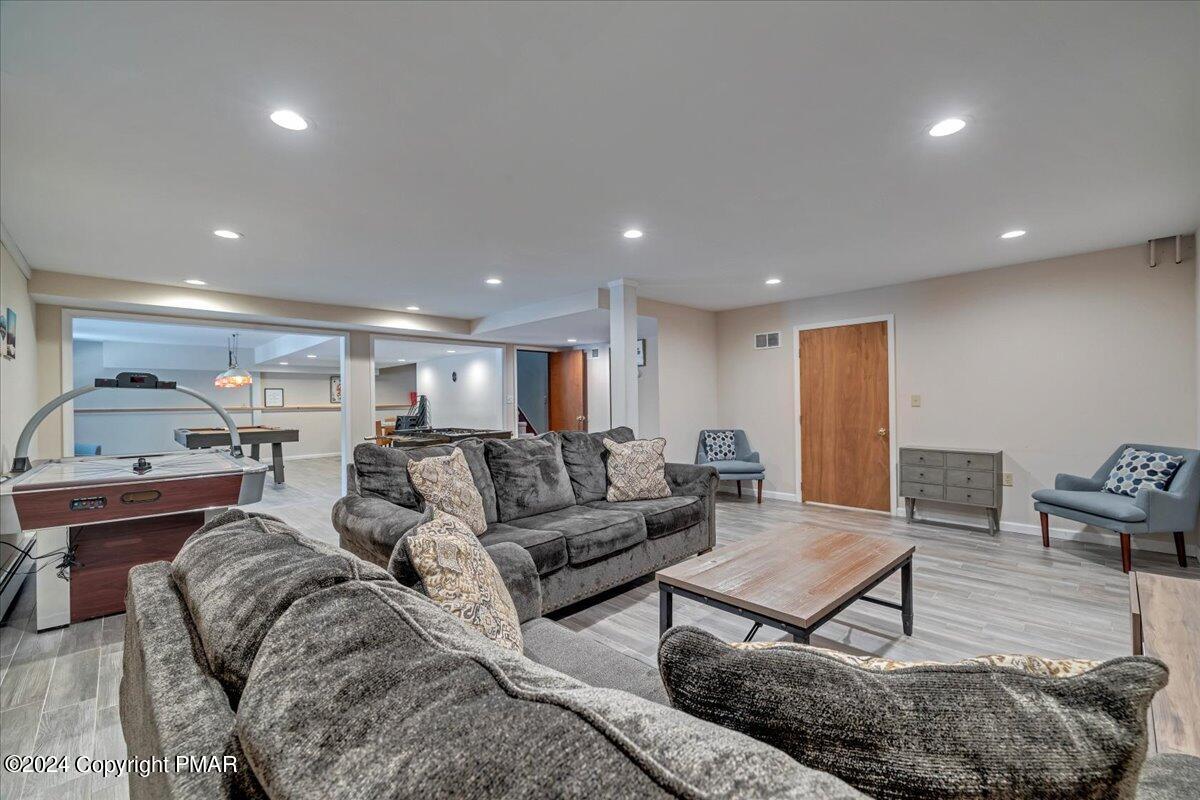 401 Minsi Trail West Long Pond, PA 18334 - Photo 29 of 34 a living room with furniture and a couch