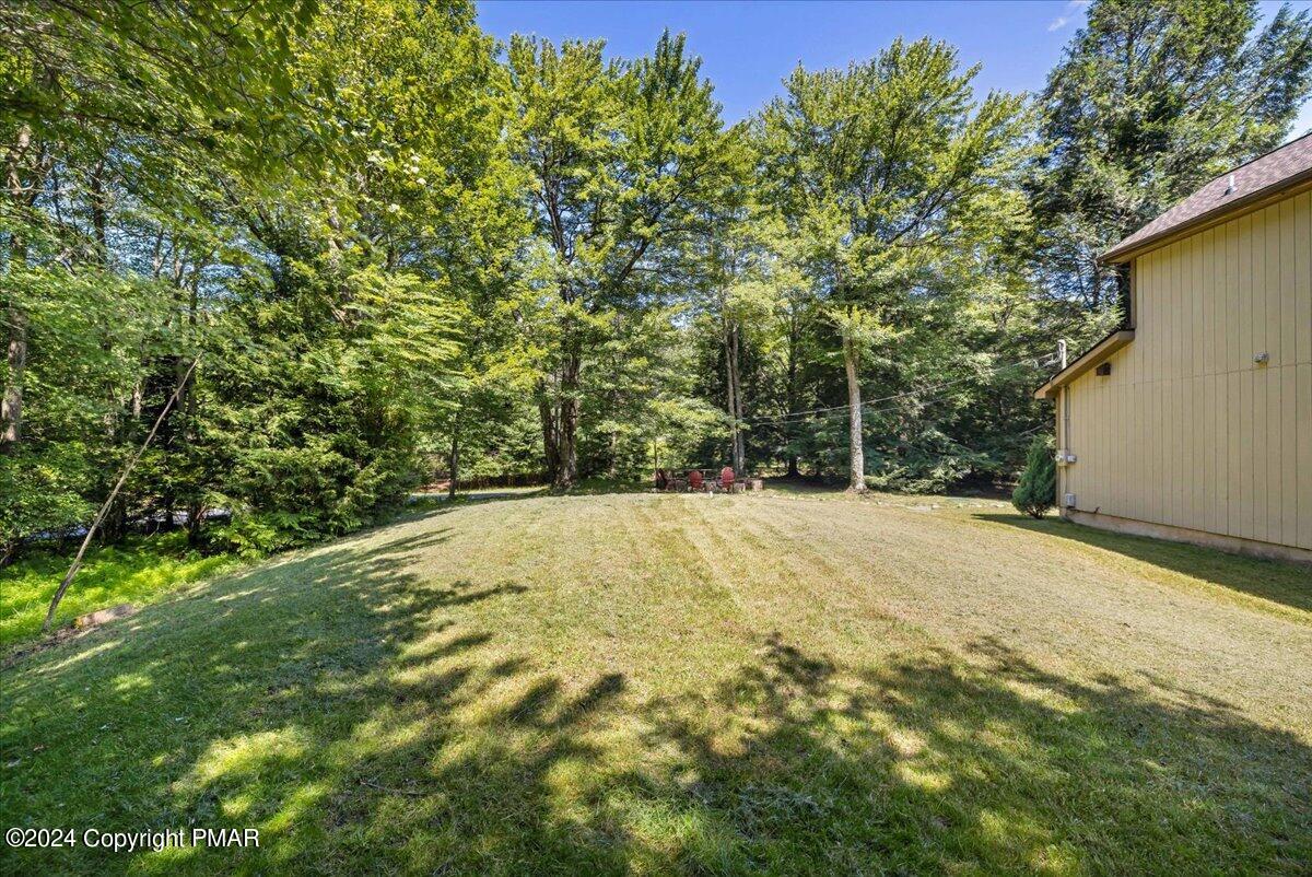 401 Minsi Trail West Long Pond, PA 18334 - Photo 4 of 34 a view of a yard with a tree