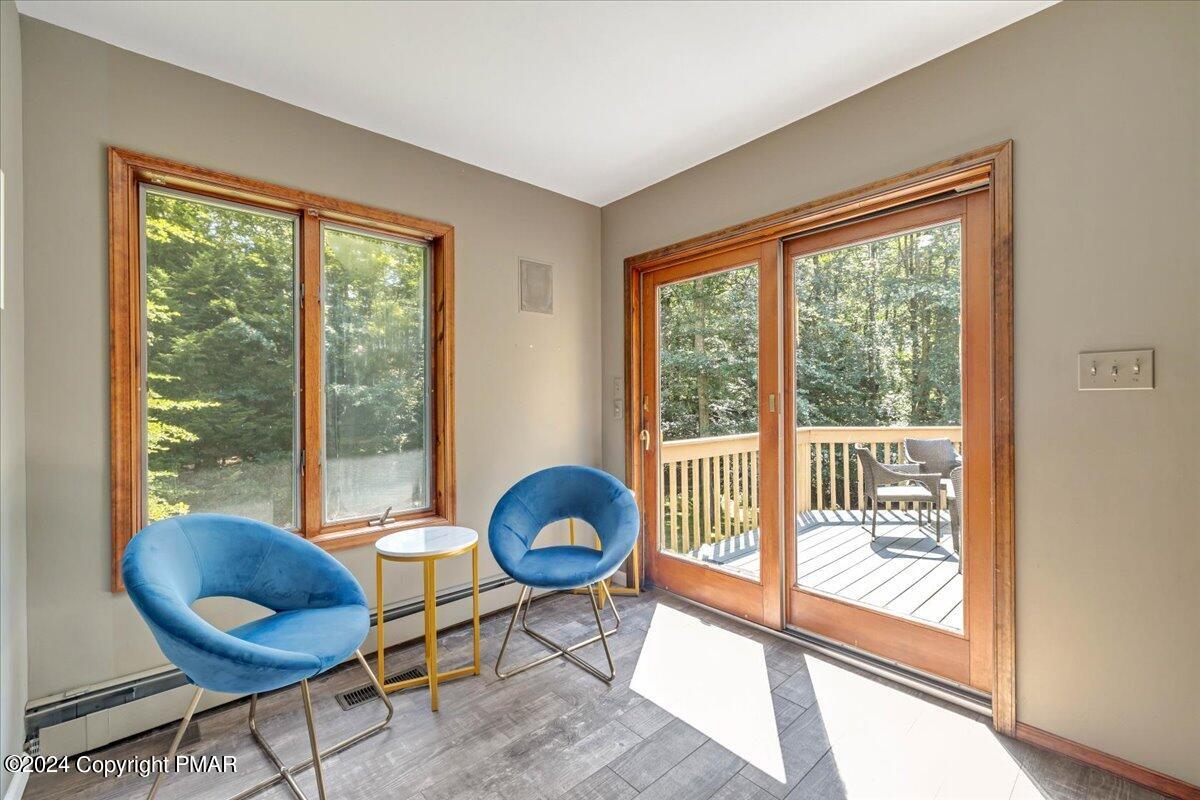 401 Minsi Trail West Long Pond, PA 18334 - Photo 8 of 34 a living room with furniture and a floor to ceiling window
