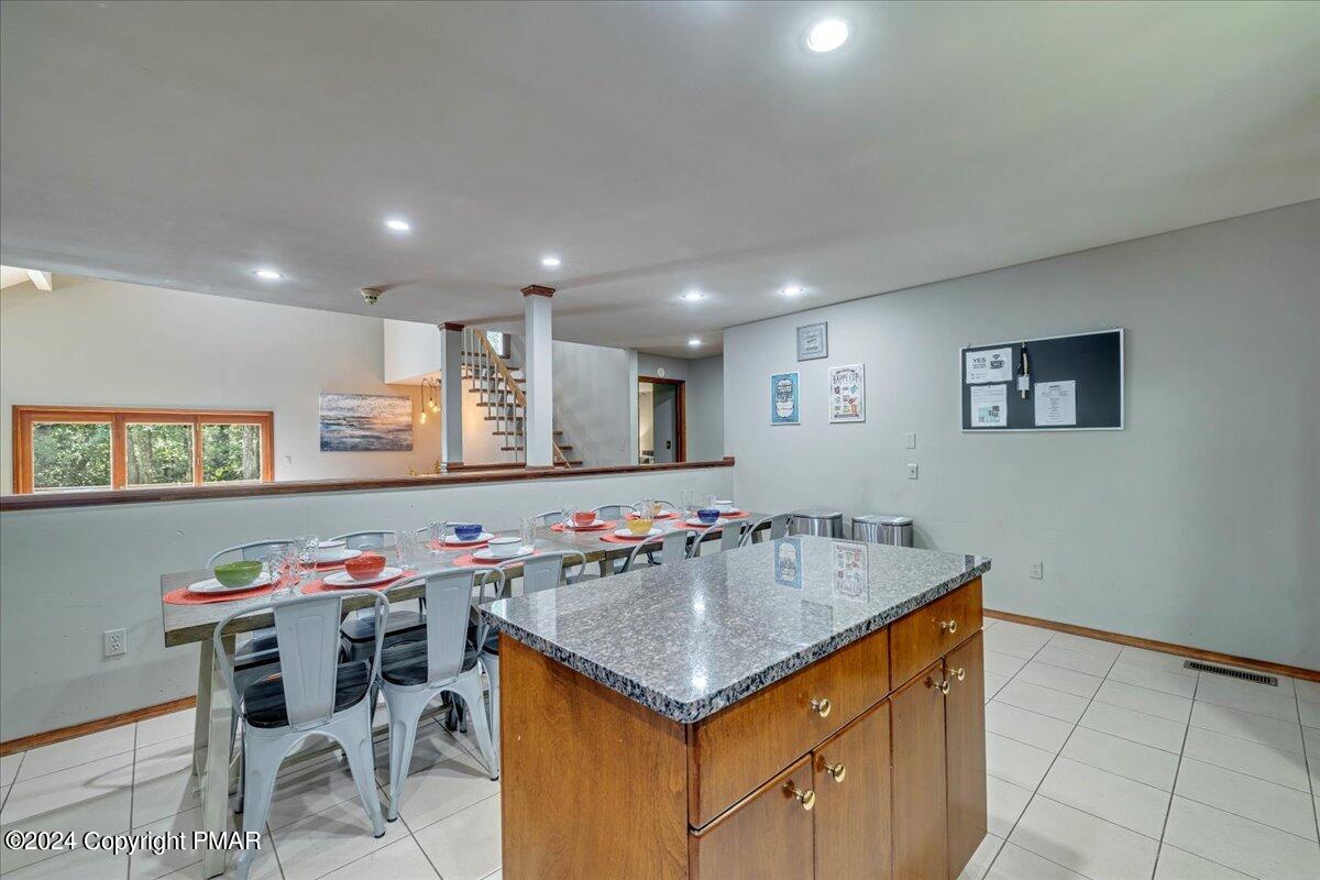 401 Minsi Trail West Long Pond, PA 18334 - Photo 9 of 34 a kitchen that has a table and chairs in it
