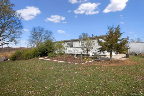 a view of a street with a building in the background