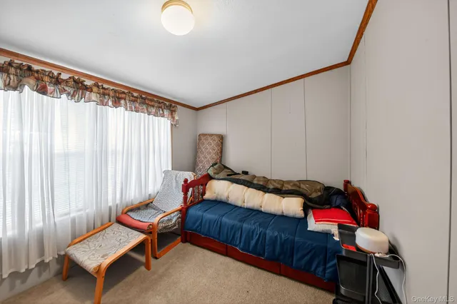 a bathroom with a bathtub and a window