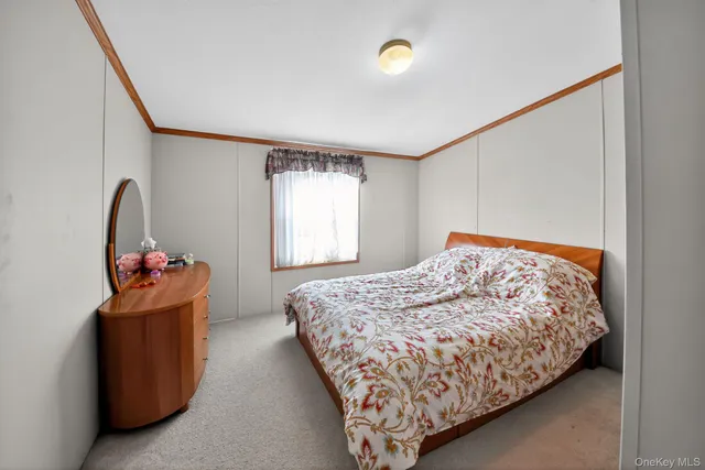 a bathroom with a toilet and a shower curtain