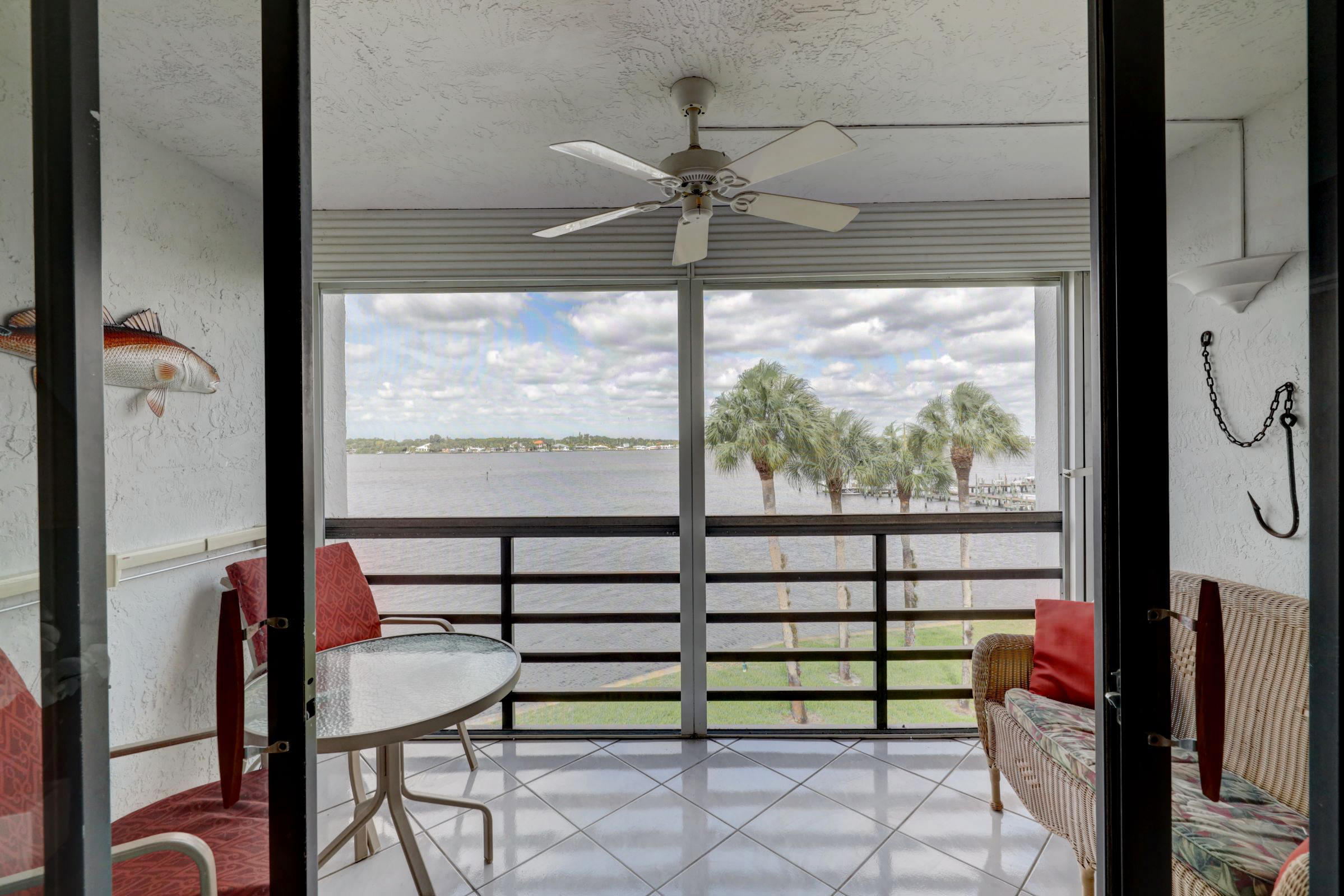 1950 Southwest Palm City Road, Unit 88306 Stuart, FL 34994 - Photo 6 of 40 Living Room patio view