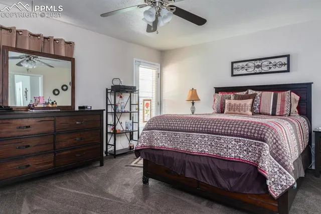 a bedroom with a bed and a dresser