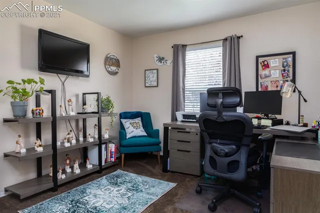 a bedroom with a bed and a television