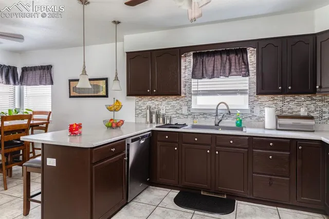 a room with a sink and cabinets