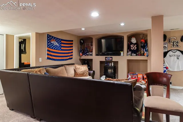 a room with furniture and pool table